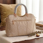 Quilted shoulder bag pom-pom charm