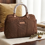 Quilted shoulder bag in brown