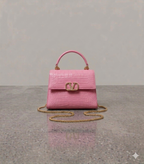 Crocodile textured handbag in pink