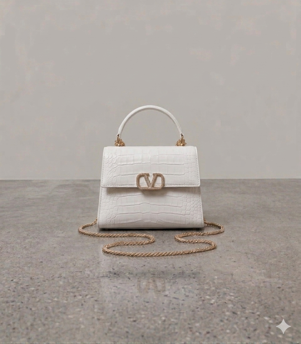 Crocodile textured handbag in white