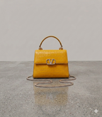 Crocodile textured handbag in yellow